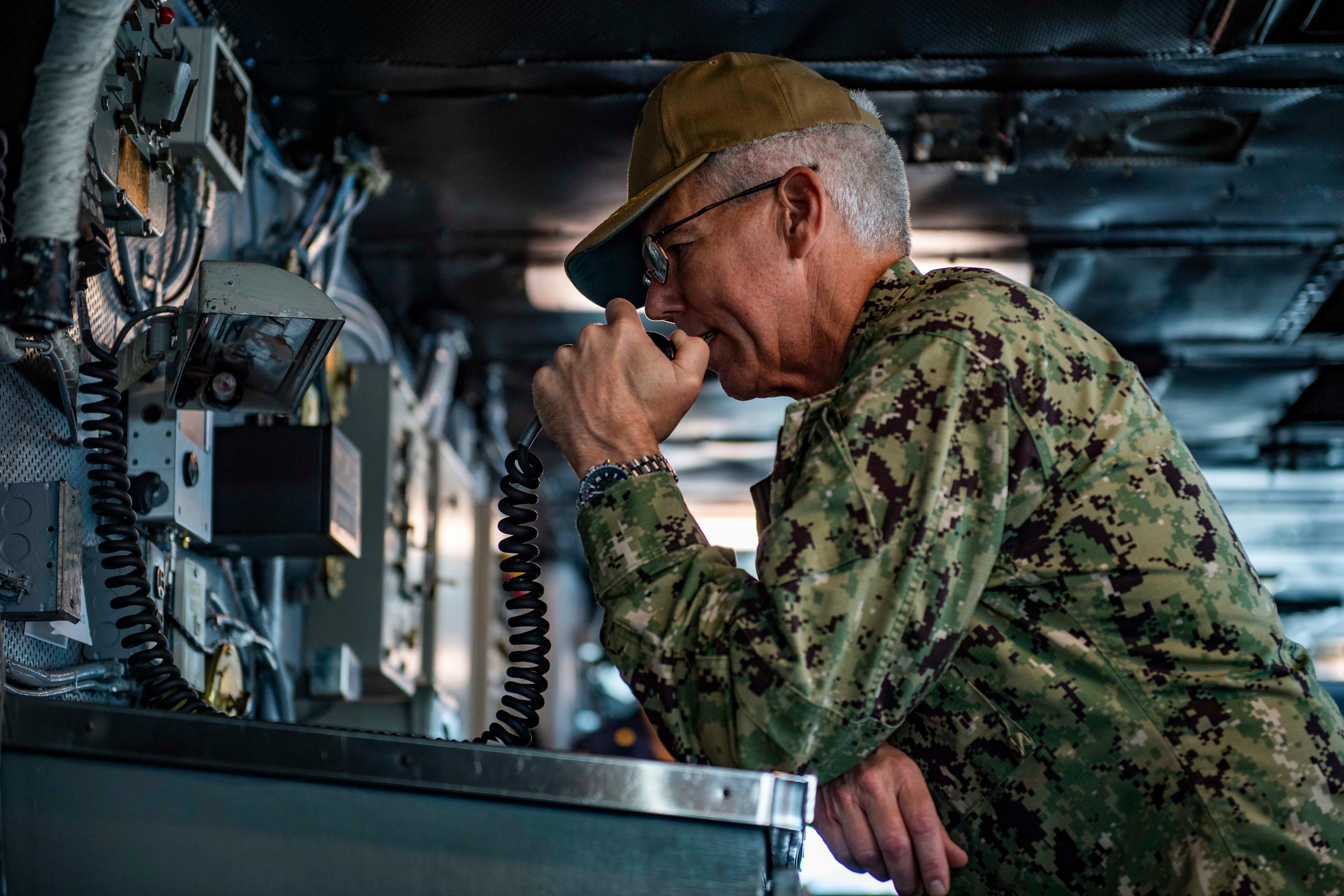 Vice Adm. Karl Thomas, commander of the 7th Fleet, addresses the crew of Nimitz-class aircraft carrier USS Carl Vinson during a visit in August 2021.