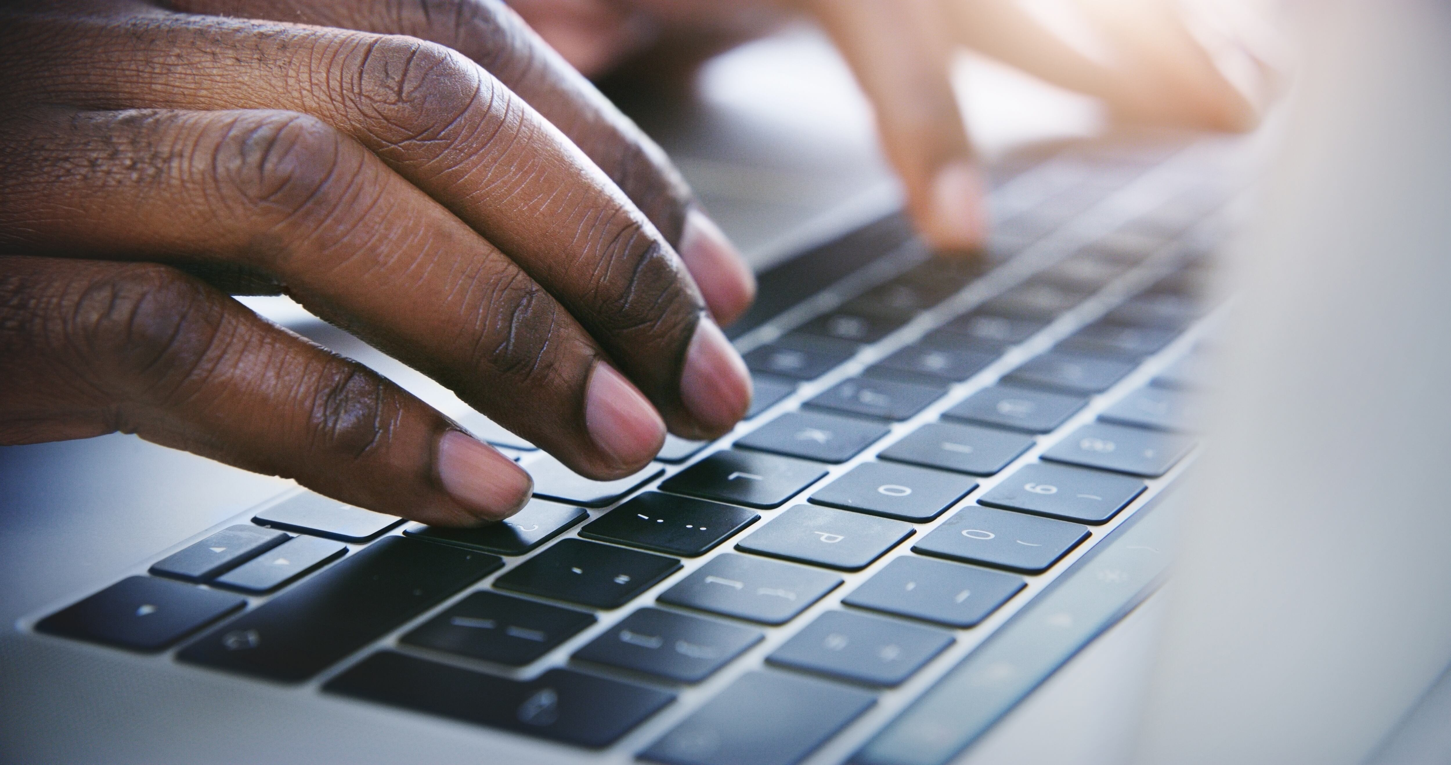 Person typing on a laptop