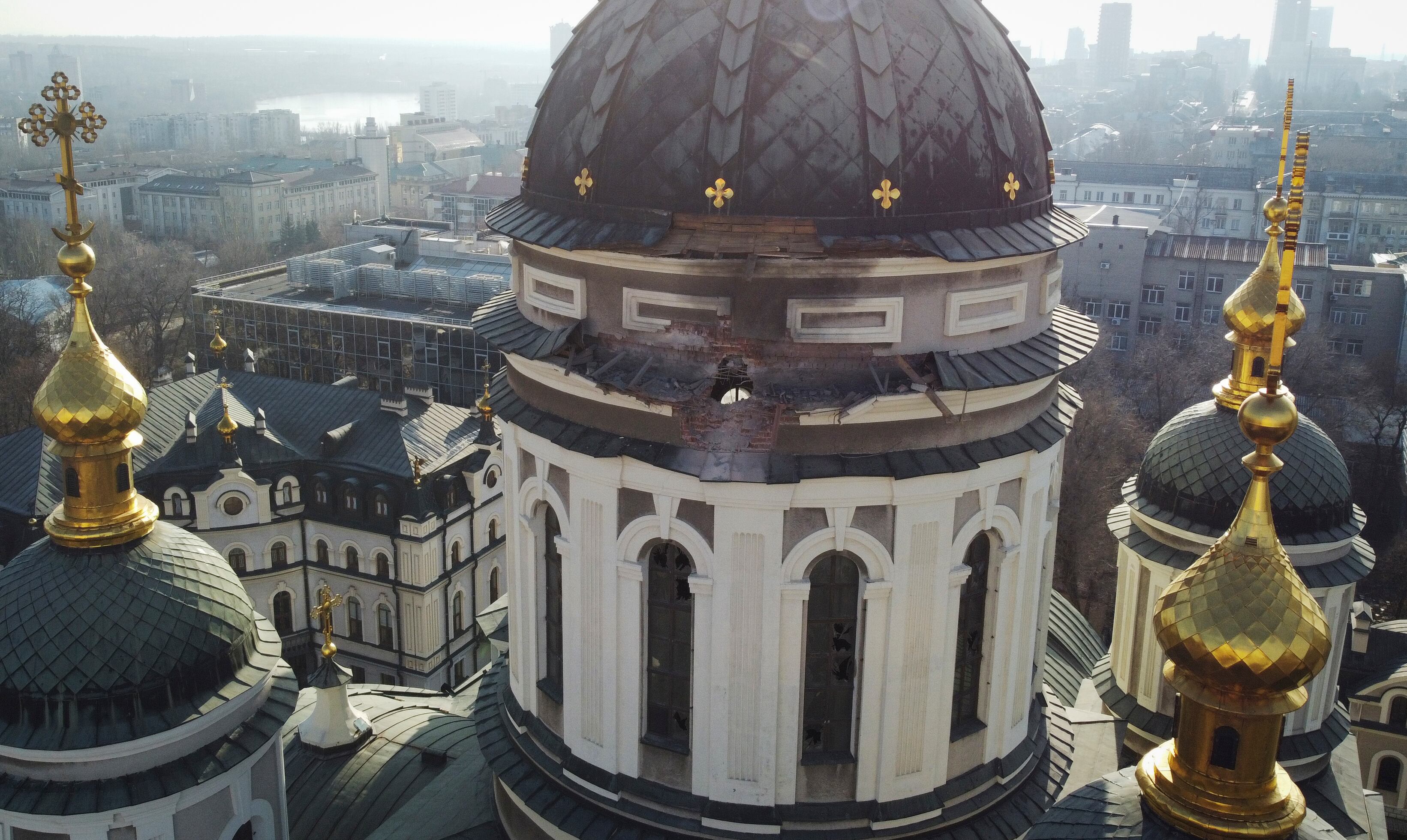 A hole from a shell explosion in the dome of a church is seen after what Russian officials in Donetsk said was a shelling by Ukrainian forces, in Donetsk, the capital of Russian-controlled Donetsk region, eastern Ukraine, Thursday, Dec. 15, 2022.