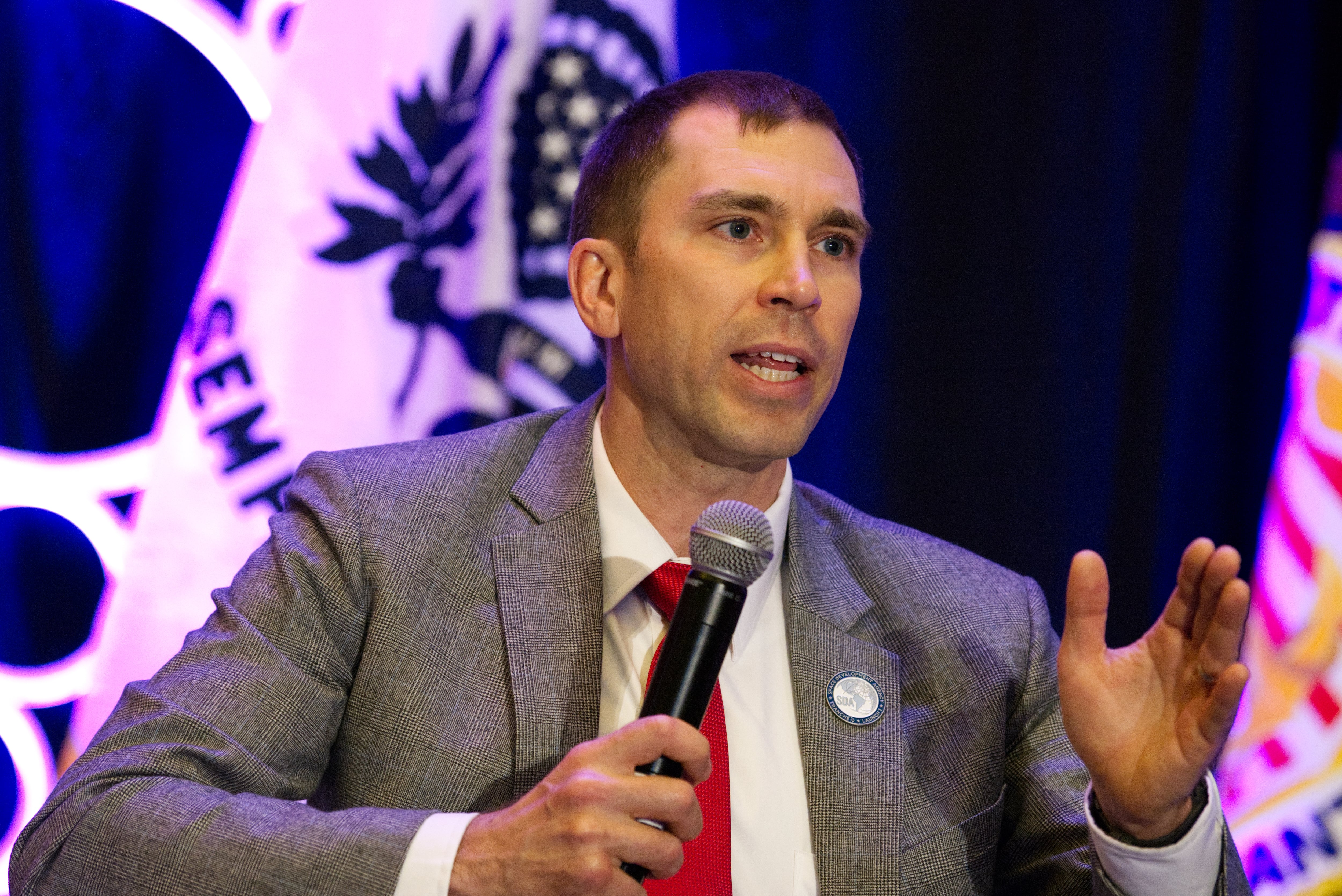 Space Development Agency Director Derek Tournear gestures as he answers a question at the Sea-Air-Space conference in National Harbor, Maryland, on April 3, 2023.