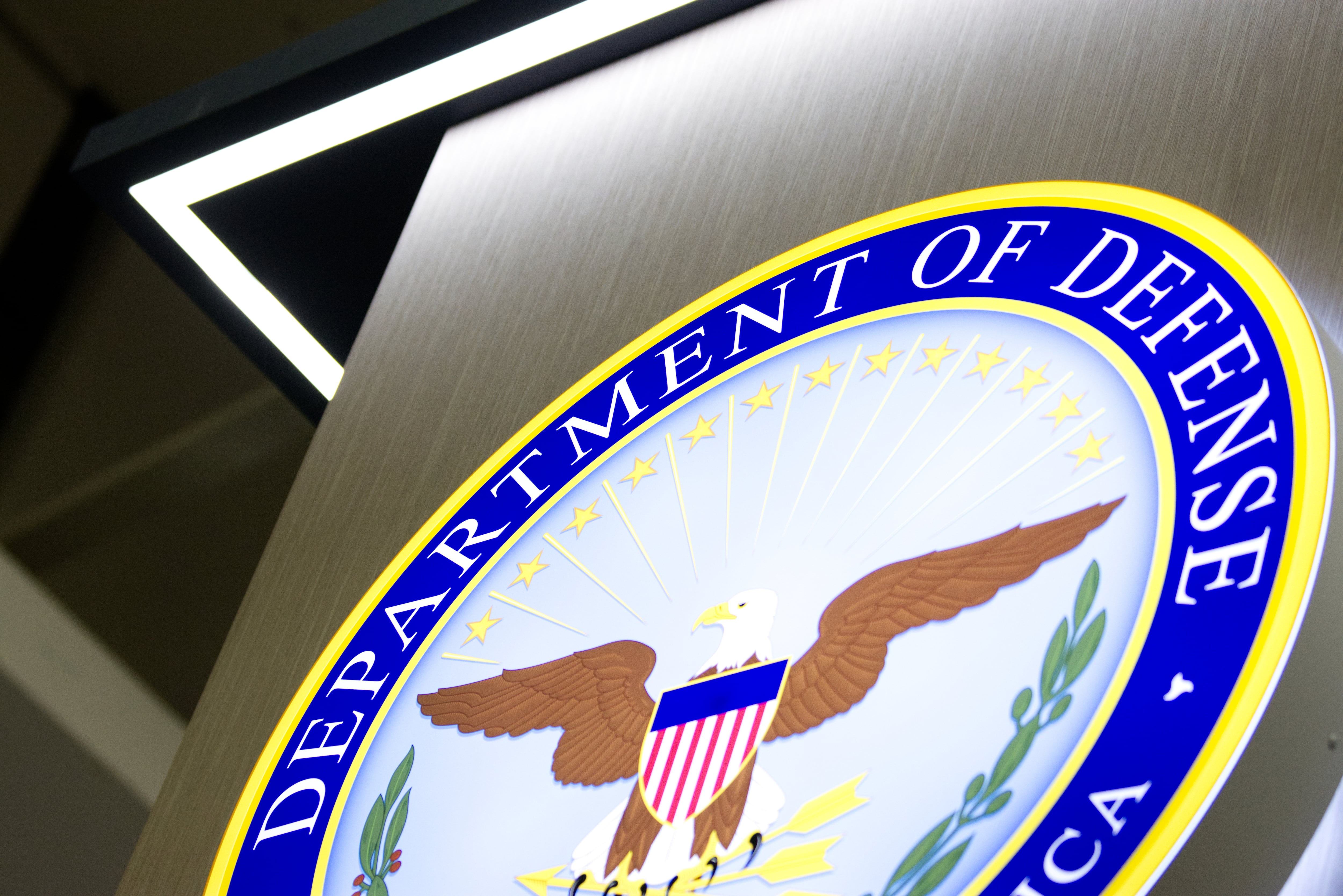 A U.S. Department of Defense logo adorns a booth at the Association of the U.S. Army annual convention in Washington, D.C.