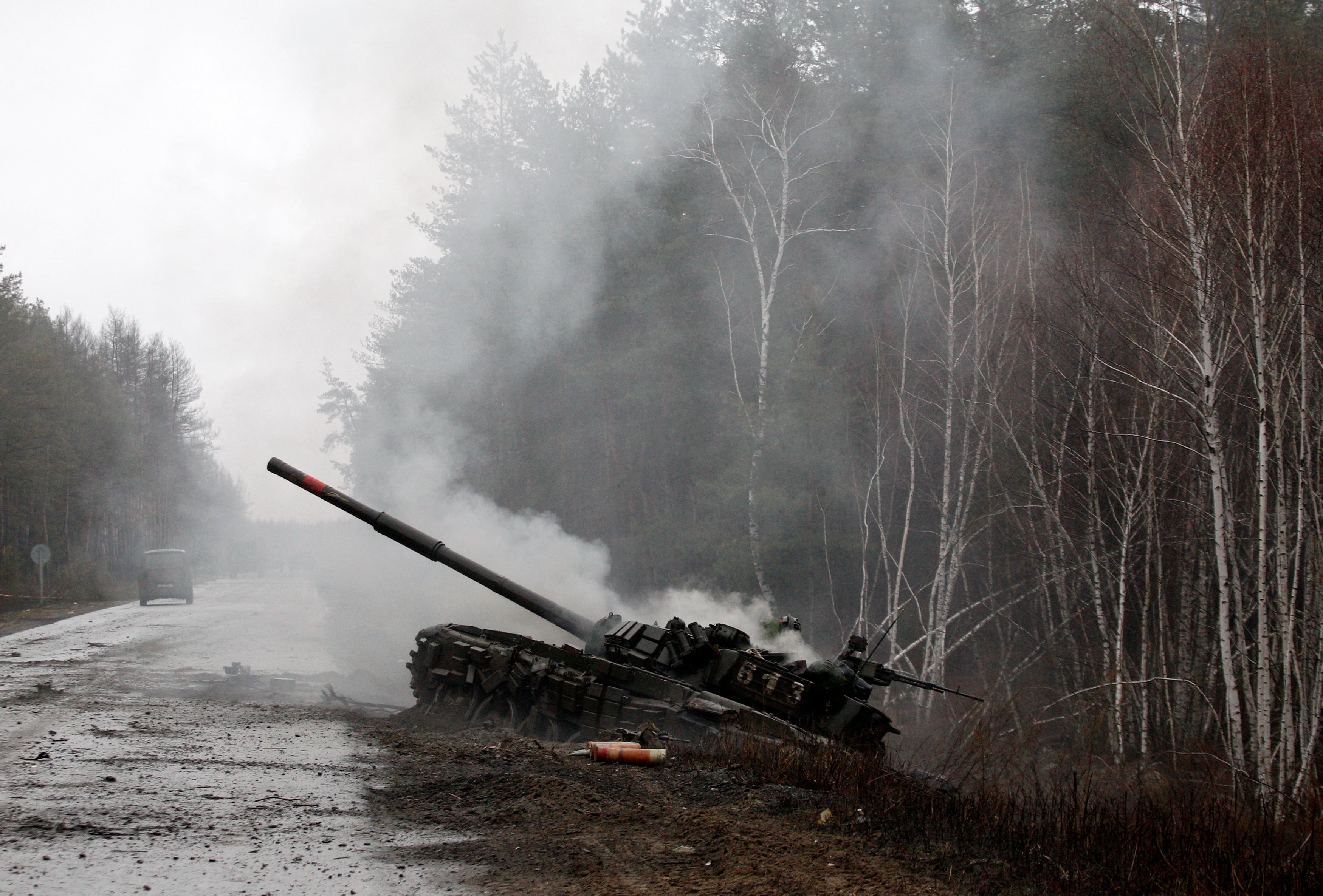 Smoke billows from a Russian tank destroyed by Ukrainian forces in the Lugansk region on Feb. 26, 2022.