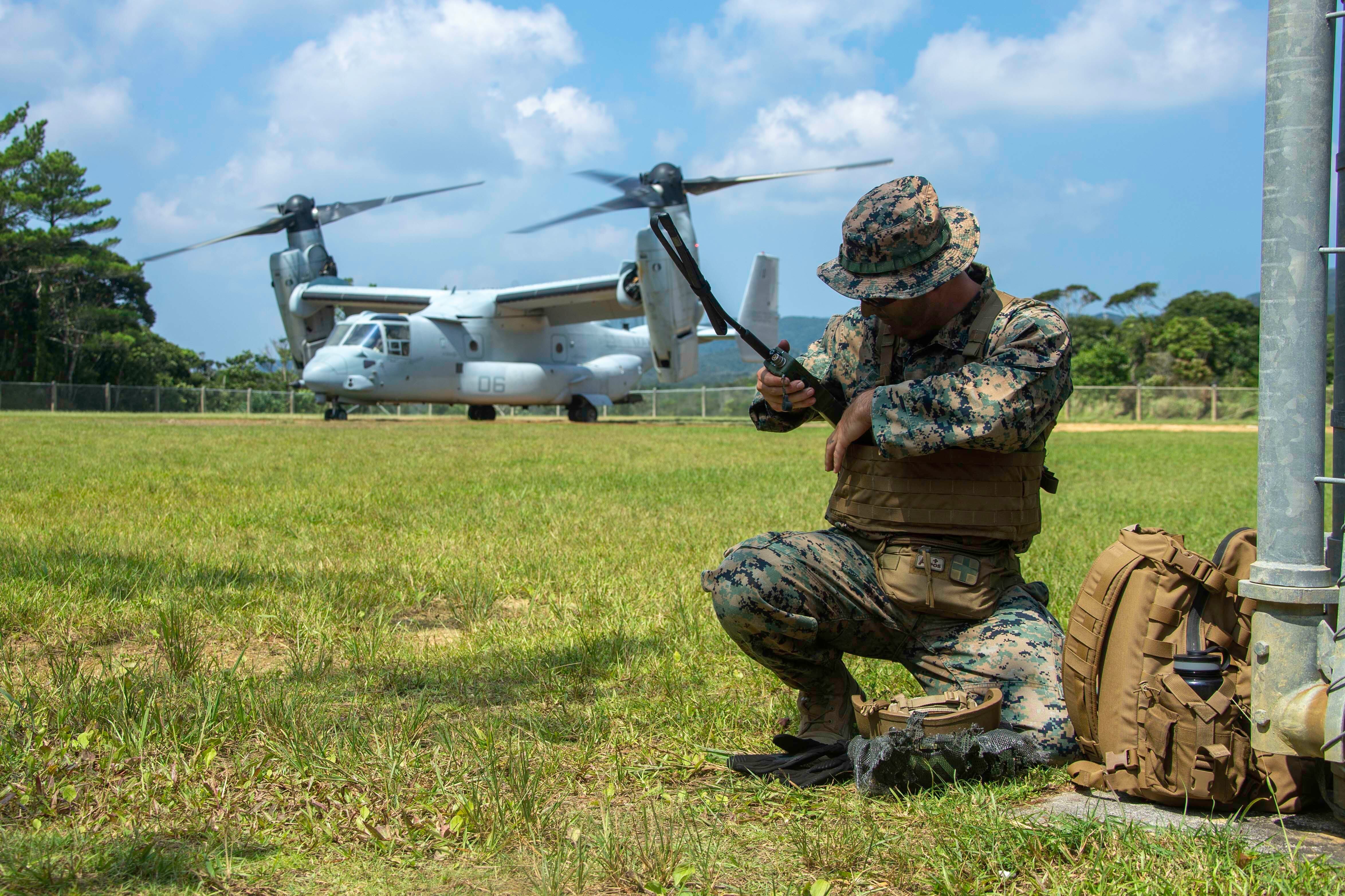 U.S. Marine Corps Staff Sgt. Devon Wheeler establishes communications during the Indo-Pacific Warfighting Exercise in the Northern Training Area on Okinawa, Japan, in August 2021.