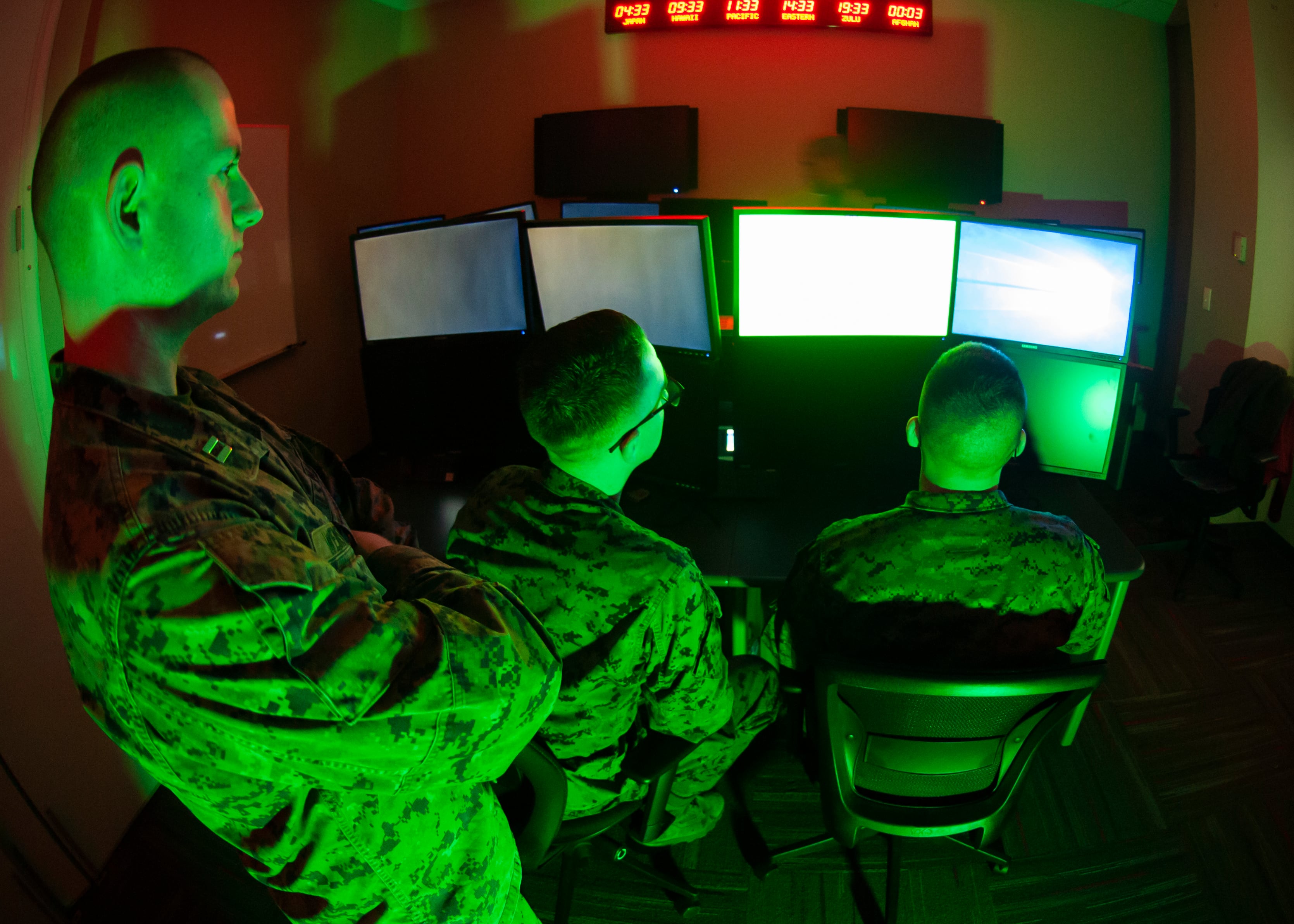 Marines with U.S. Marine Corps Forces Cyberspace Command pose for photos in a cyber operations room at Fort Meade, Maryland, in February 2020.