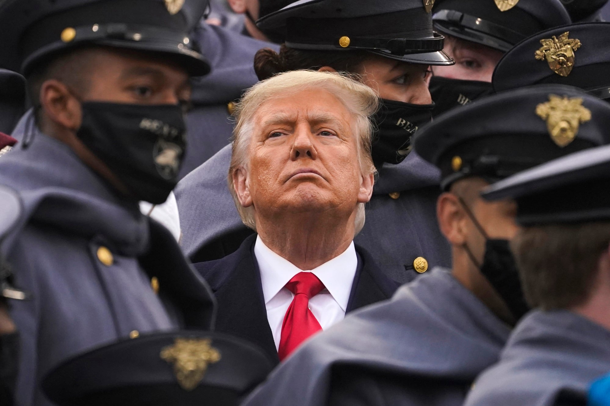 Surrounded by Army cadets, President Donald Trump watches the first half of the 121st Army-Navy Football Game in Michie Stadium at the United States Military Academy, Saturday, Dec. 12, 2020, in West Point, N.Y.