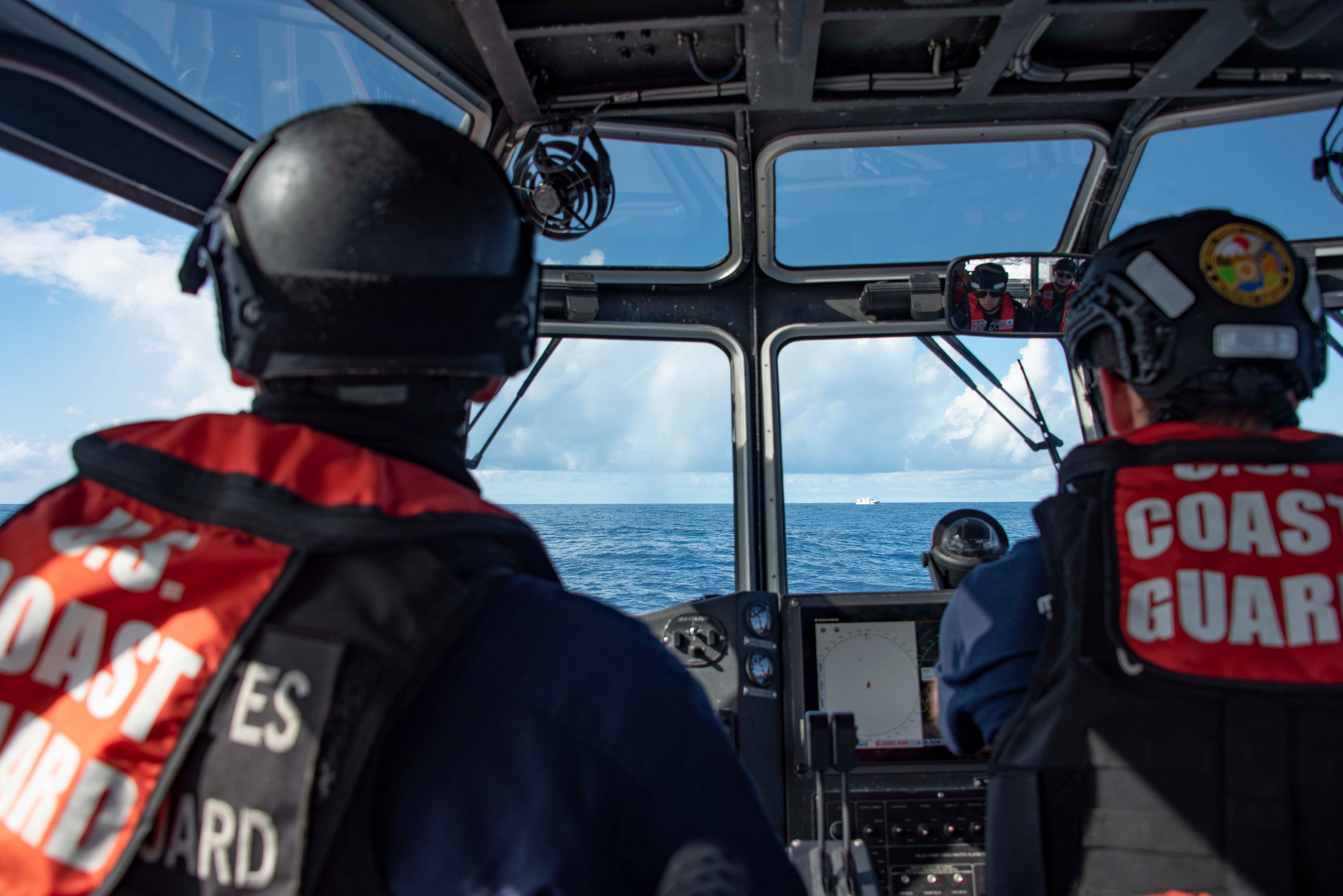 U.S. Coast Guard crew members assigned to the cutter Stratton drive a long range interceptor boat towards a Taiwan fishing vessel during illegal, unreported, and unregulated fishing operations in the Pacific Ocean, Feb. 2, 2022.